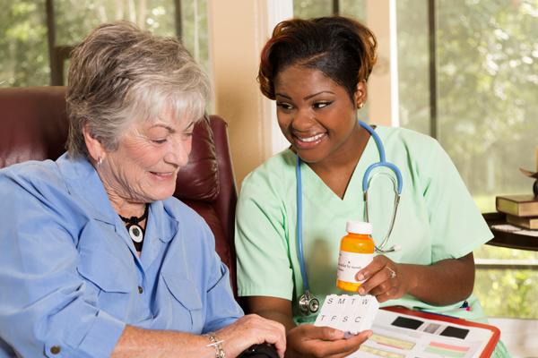 nurse and patient looking at medication